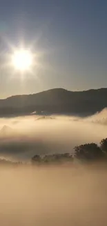 Breathtaking sunrise over misty mountains with clear blue sky.