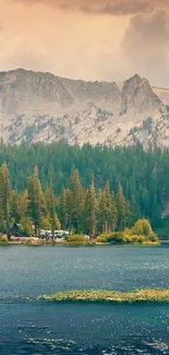 Serene mountain lake with lush forest and towering peaks.