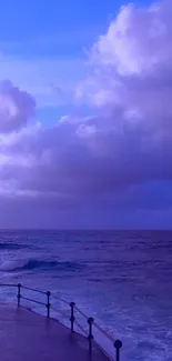 Purple ocean view with cloudy sky wallpaper.