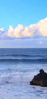 Serene ocean with waves under a bright blue sky.