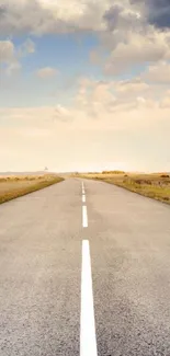 Serene road under a blue sky, perfect for mobile wallpaper.