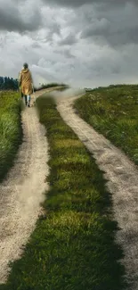 Single figure walking on a forked rural path under cloudy sky, surrounded by green fields.