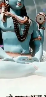 Serene Lord Shiva in meditation with light blue background.