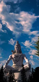 Lord Shiva meditating under a blue sky, surrounded by clouds and nature.