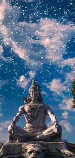 Shiva statue under a vibrant blue sky.