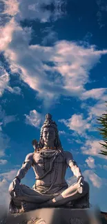 Serene statue of Lord Shiva under a vibrant sky.