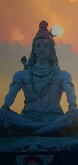 Shiva statue meditating at sunset with orange sky background.