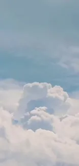 Tranquil sky with fluffy white clouds and soft blue tones.