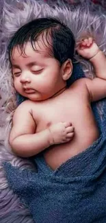 Serene mobile wallpaper of a baby peacefully sleeping wrapped in blue fabric.