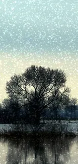 Serene wallpaper with tree by water in snowfall.