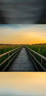 Boardwalk path under a sunset sky