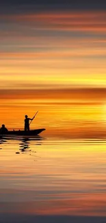 Tranquil sunset with boat silhouette reflecting on orange water.