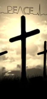 Silhouetted crosses against a sepia sunset sky with the word 'Peace' above.