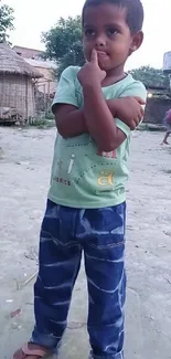 Thoughtful child in a rural courtyard setting.