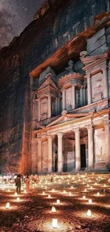 Petra in Jordan illuminated at night by candles under a starry sky, enchanting view.