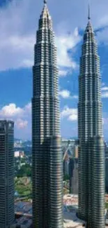 Petronas Towers with blue sky backdrop.