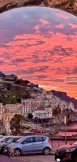 Colorful sunset over Italian coastal village, with vibrant skies and serene waters.