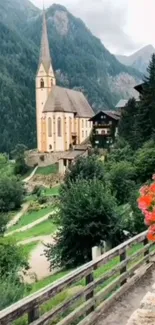 Scenic mountain village with a church, lush greenery, and vibrant flowers.