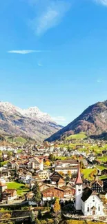 Scenic mobile wallpaper of a mountain village under a clear blue sky.