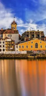 Vibrant riverside town with reflections and colorful buildings.