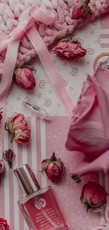 Pink floral wallpaper with roses, perfume, and decorative elements.