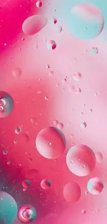 Abstract pink and aqua bubble design wallpaper.