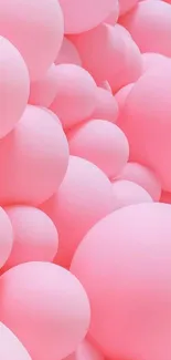 Pink balloons create a dreamy mobile wallpaper scene.