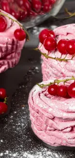 Pink swirled desserts with red berries on top