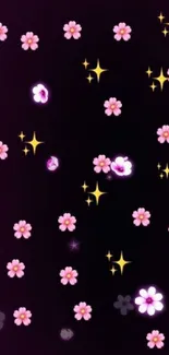 Pink flowers and stars on a dark background wallpaper.