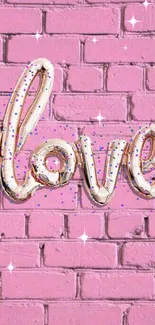 Love balloon script on pink brick wall with confetti.