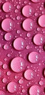 Pink water droplets on a textured background.