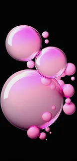 Glossy pink bubbles on black background wallpaper.