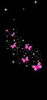 Pink butterflies and stars on black background wallpaper.