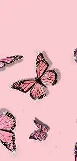 Elegant mobile wallpaper with pink butterflies on a pastel pink background.