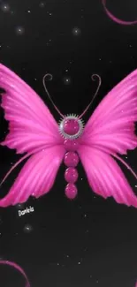 Pink butterfly with ribbons on black background wallpaper.