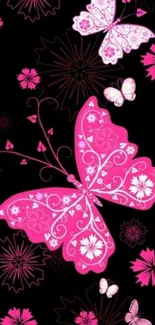 Pink butterfly wallpaper with floral patterns on a black background.