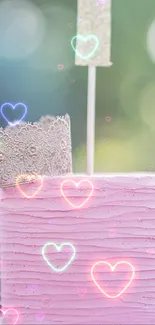 Whimsical pink cake with lace crown and hearts design.