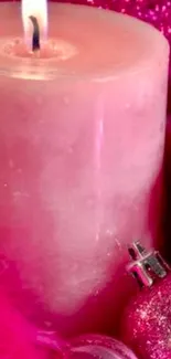 Close-up of a pink candle with glitter background.