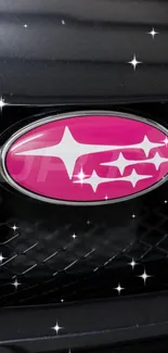 Pink car emblem with stars on a black grille background.