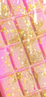 Pink chocolate bar with gold glitter and star accents.