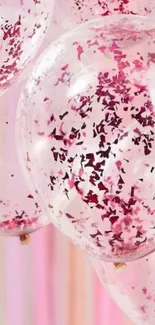 Pink confetti-filled balloons mobile wallpaper for a vibrant party theme.