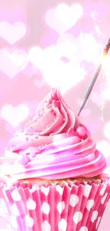 Pink cupcake with sparkler on pastel background.