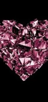 A sparkling pink diamond heart on a black background.