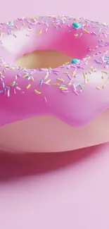 Pink donut with sprinkles on a pastel background.