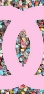 Pink emblem on colorful glitter background.