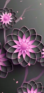 Pink geometric flowers on dark background.