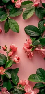 Pink floral wallpaper with lush green leaves and blossoms.