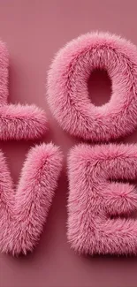 Fluffy pink letters spelling 'LOVE' on a mauve background.