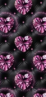Pink gem hearts on a black tufted background.