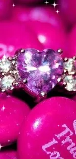 Vibrant pink heart-shaped gemstone ring with love-themed candies.